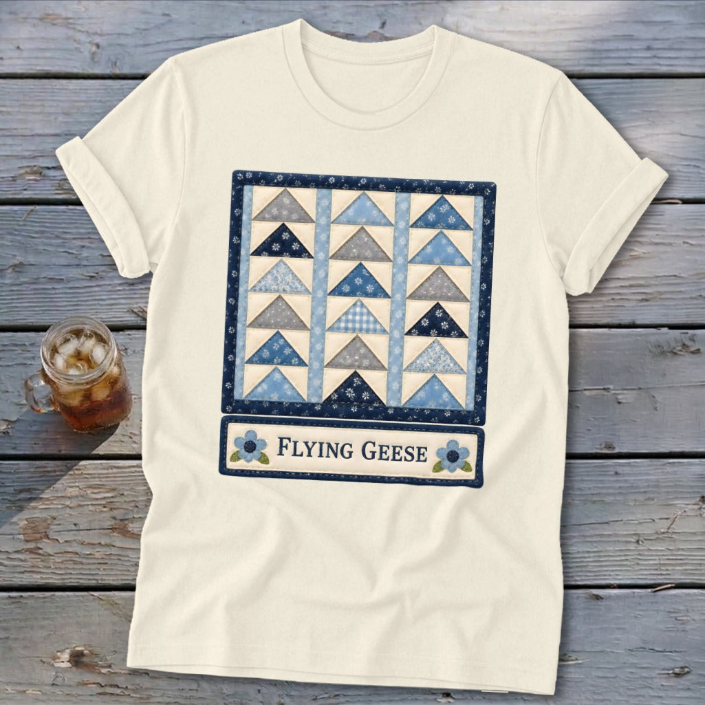 Cream t-shirt with a blue "Flying Geese" quilt design and text.