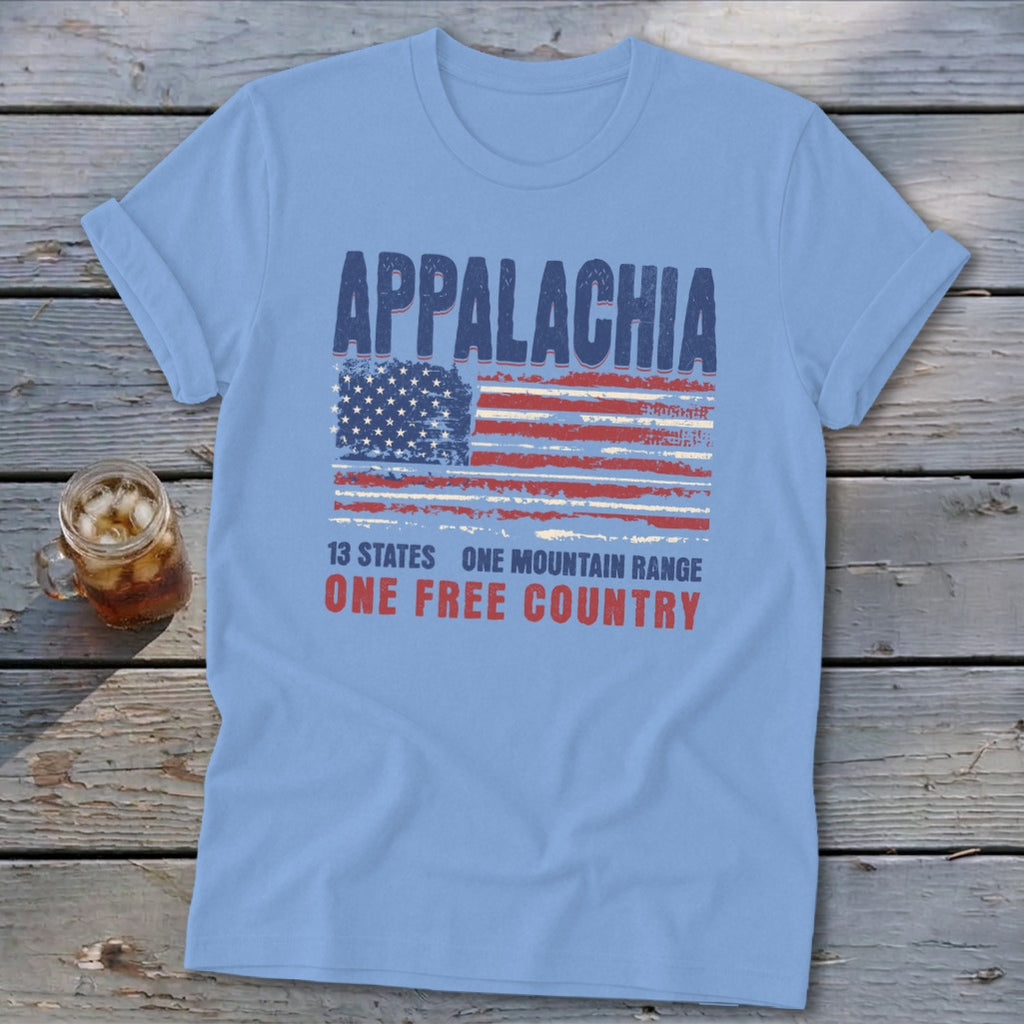 Light blue t-shirt displaying a distressed American flag and text that reads Appalachia 13 states one mountain range one free country.