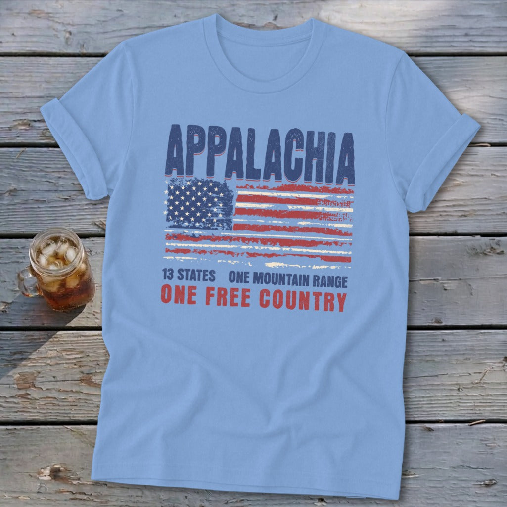Light blue t-shirt displaying a distressed American flag and text that reads Appalachia 13 states one mountain range one free country.