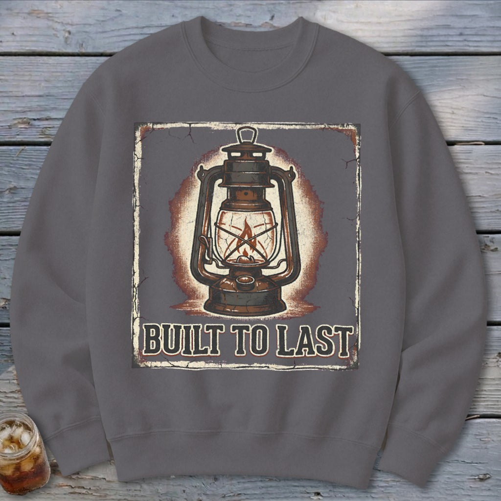 Gray sweatshirt with vintage lantern graphic and "BUILT TO LAST" text.