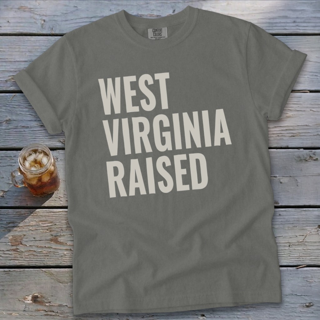 Gray t-shirt with "WEST VIRGINIA RAISED" text in white block letters.