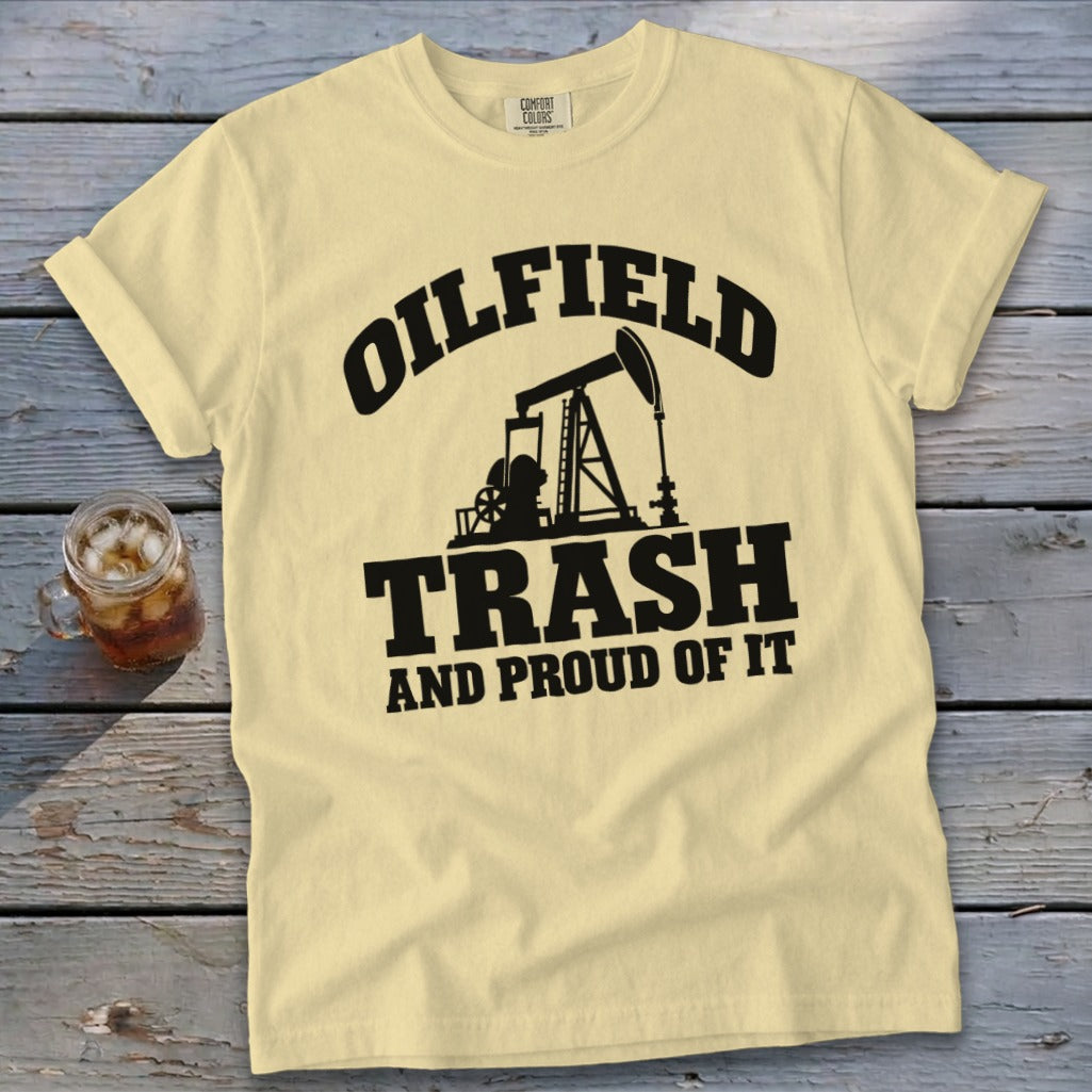 Light yellow t-shirt with black text and oil rig graphic: "Oilfield Trash And Proud Of It".