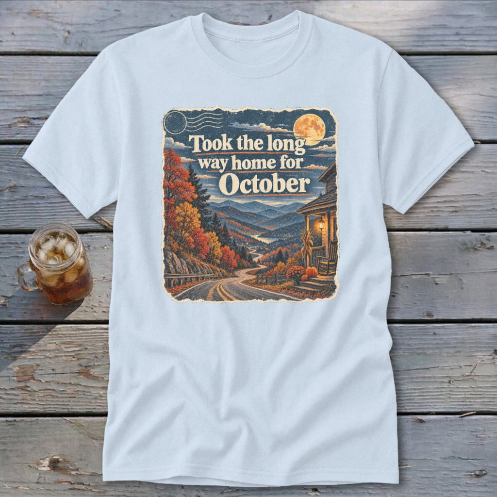 Light blue t-shirt with graphic "Took the long way home for October" and autumn mountain scene.