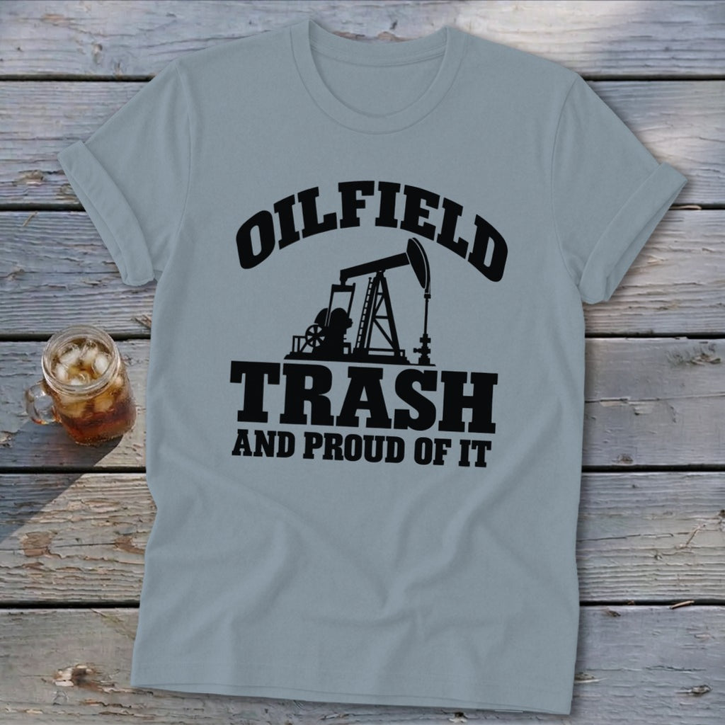 Light blue t-shirt with black text and oil pump graphic: "Oilfield Trash and Proud of It."