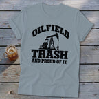 Light blue t-shirt with black text and oil pump graphic: "Oilfield Trash and Proud of It."