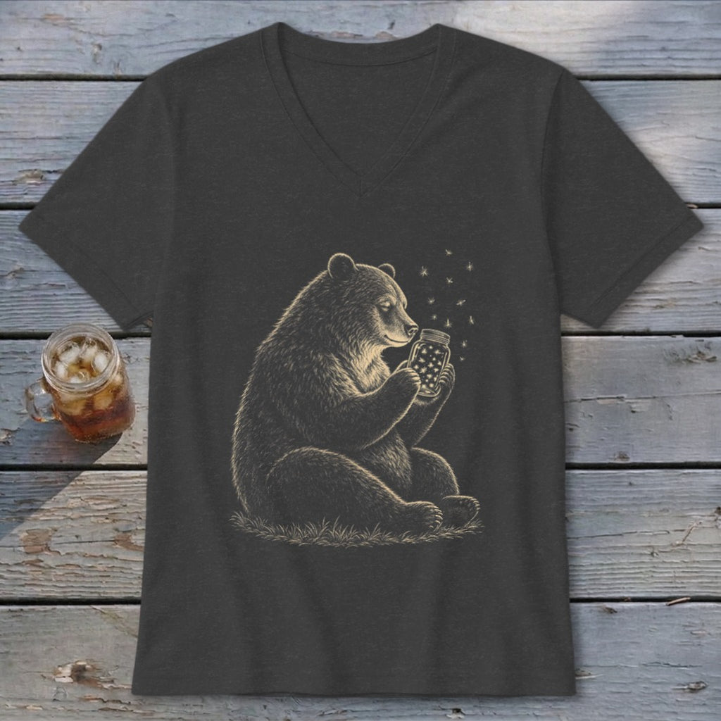 Bear sitting and holding a jar with fireflies, with a drink in a mason jar beside it.