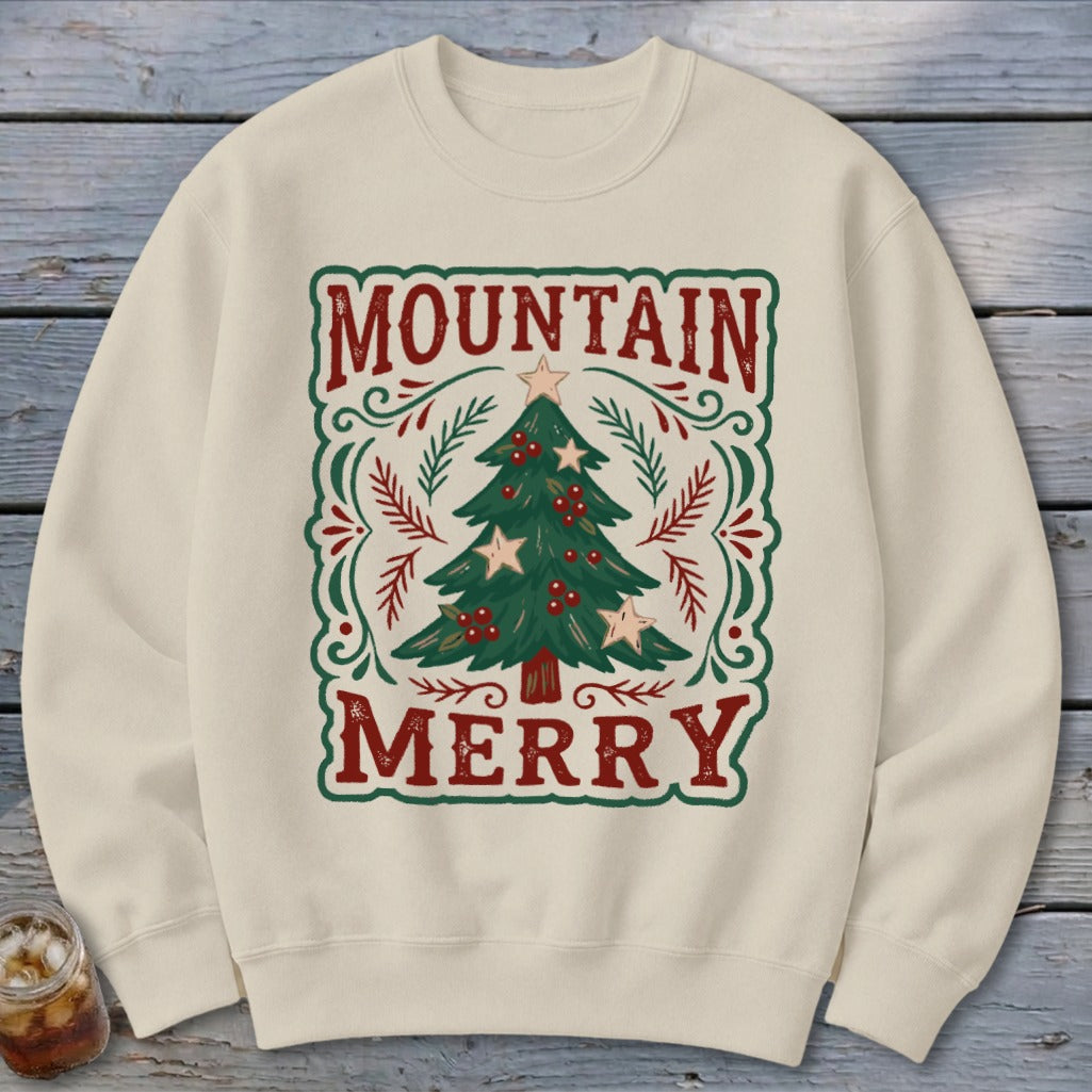 Beige crewneck sweatshirt featuring a graphic of a decorated Christmas tree with the text MOUNTAIN MERRY.