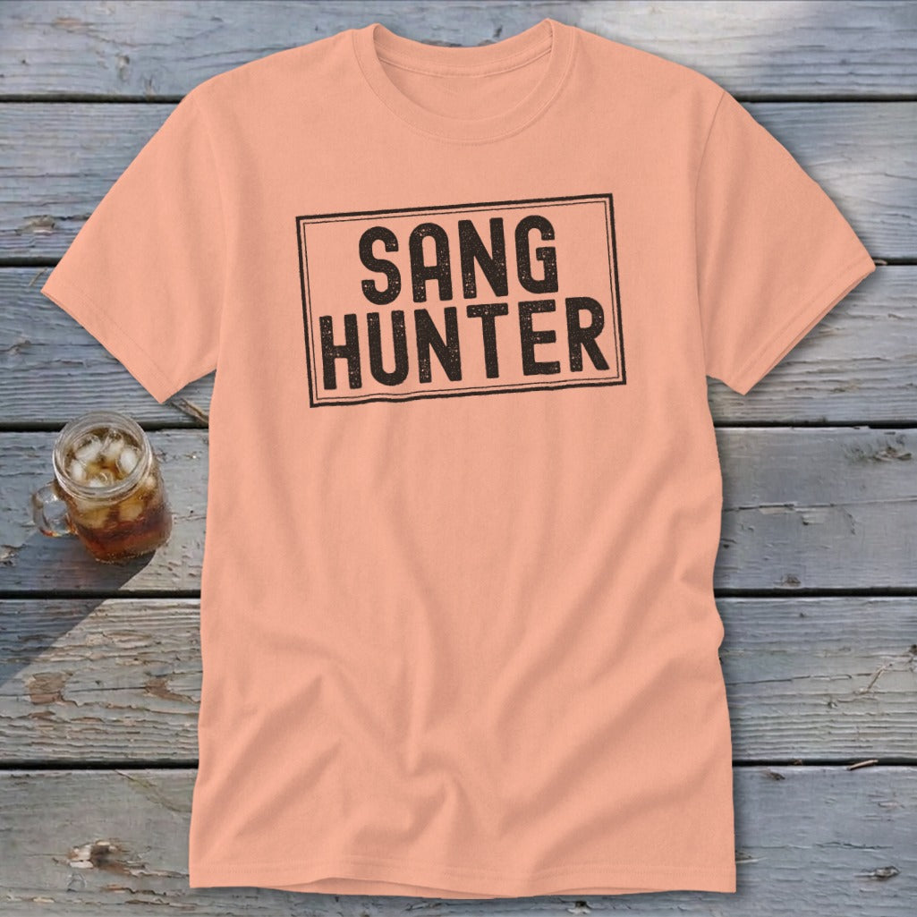 Peach t-shirt with black distressed text reading "SANG HUNTER" inside a black rectangle.