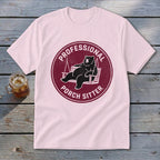 Light pink t-shirt featuring a maroon circular graphic with a lounging bear and text reading Professional Porch Sitter.