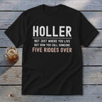 Black t-shirt with text "HOLLER NOT JUST WHERE YOU LIVE BUT HOW YOU CALL SOMEONE FIVE RIDGES OVER".