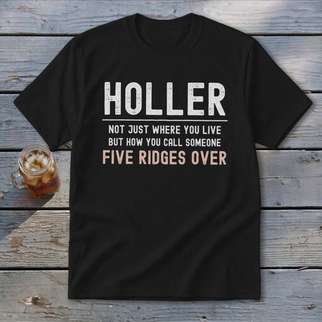 Black t-shirt with text "HOLLER NOT JUST WHERE YOU LIVE BUT HOW YOU CALL SOMEONE FIVE RIDGES OVER".