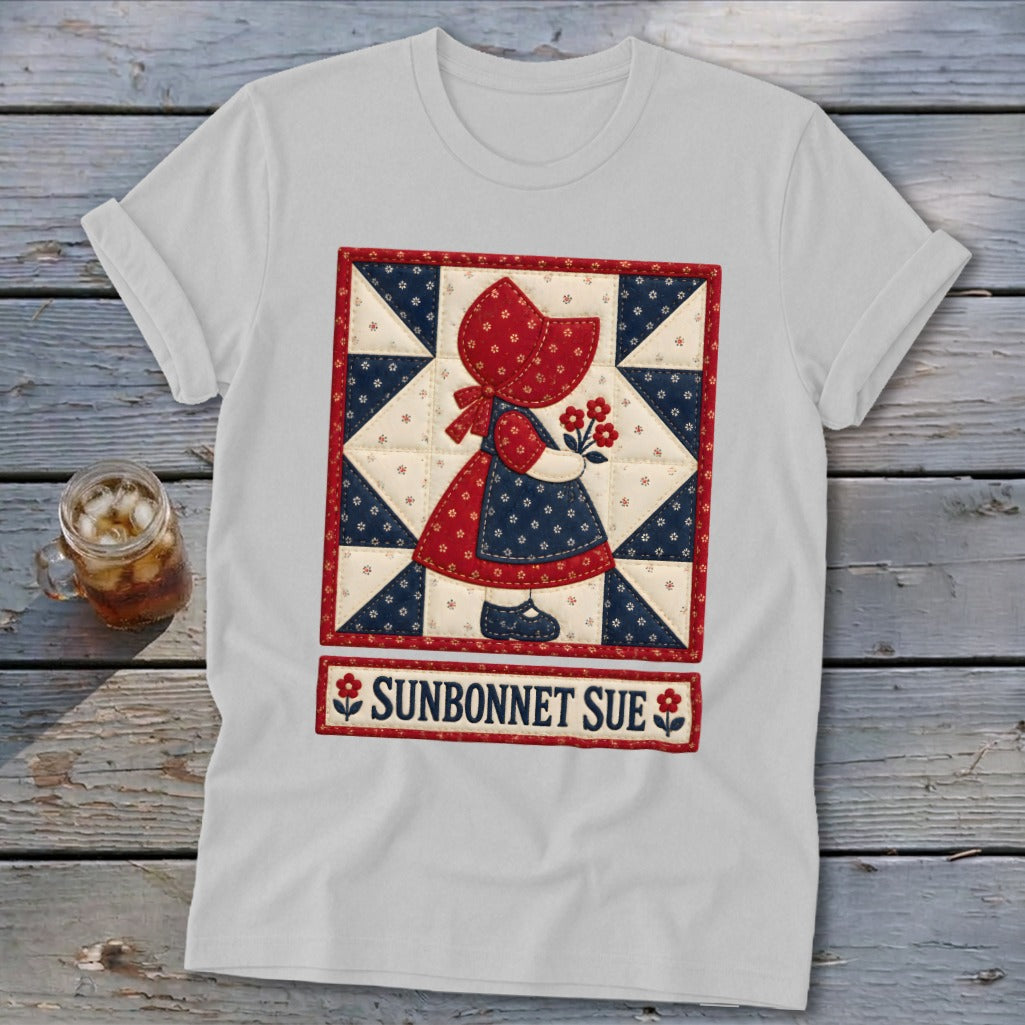 White t-shirt with a Sunbonnet Sue quilt graphic and text.