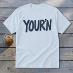 Light blue t-shirt with navy blue "YOUR'N" text.