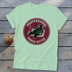 A mint green t-shirt with a red circular graphic showing a bear relaxing in a porch swing and the text "PROFESSIONAL PORCH SITTER".