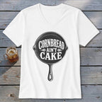 White v-neck t-shirt with cast iron skillet graphic reading "Cornbread Ain't Cake".