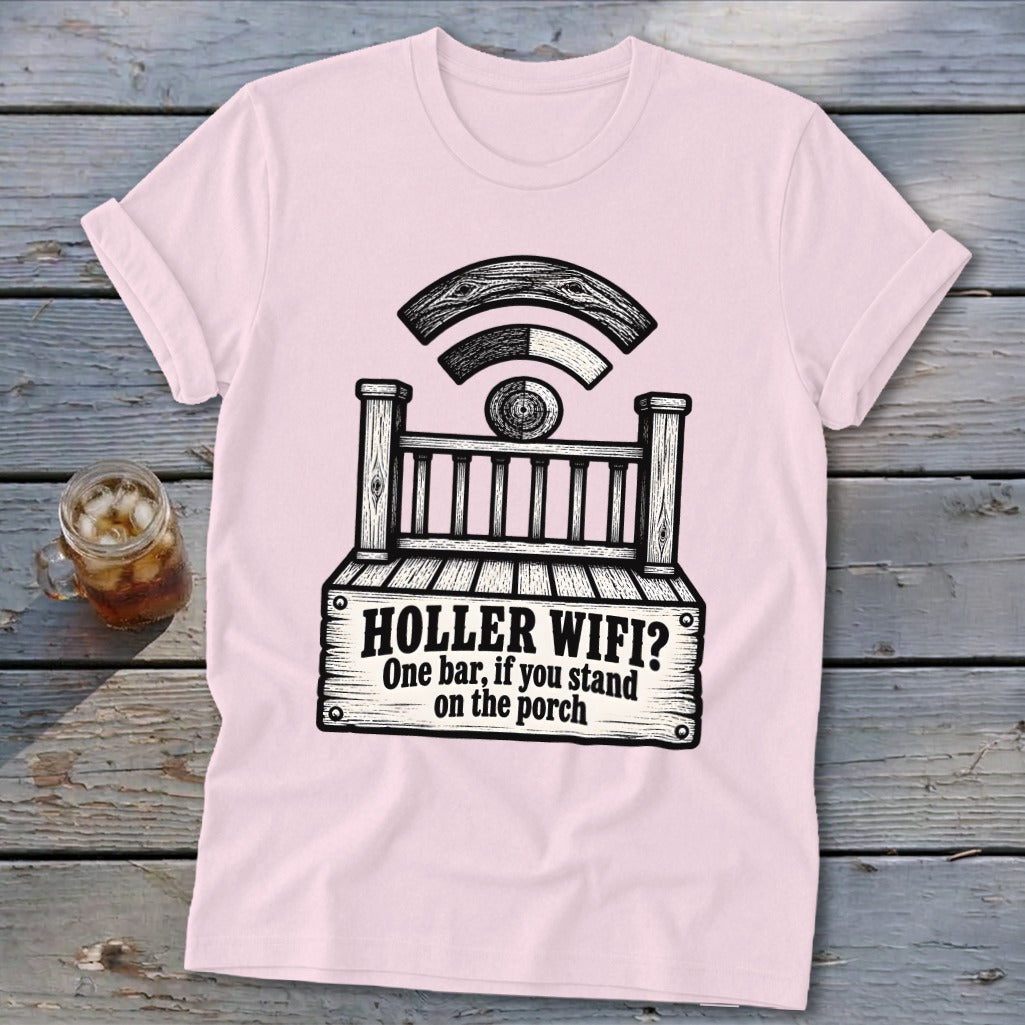 A light pink t-shirt featuring a graphic of a wooden porch with the text HOLLER WIFI? One bar, if you stand on the porch.