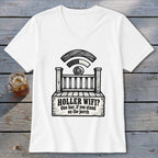 A white V-neck t-shirt featuring a black graphic of a porch with the text HOLLER WIFI? One bar, if you stand on the porch.