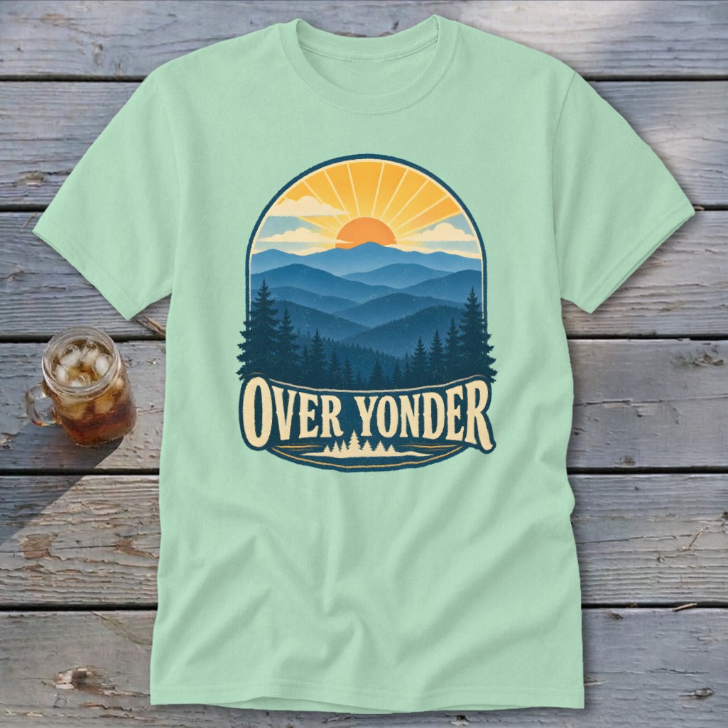Light green crewneck t-shirt featuring a retro mountain landscape graphic with the text Over Yonder.