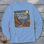 Long sleeve shirt with fall mountain scene and text "Took the long way home for October."