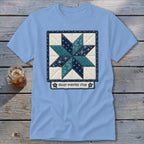 Light blue t-shirt with an eight-pointed star quilt design and text.
