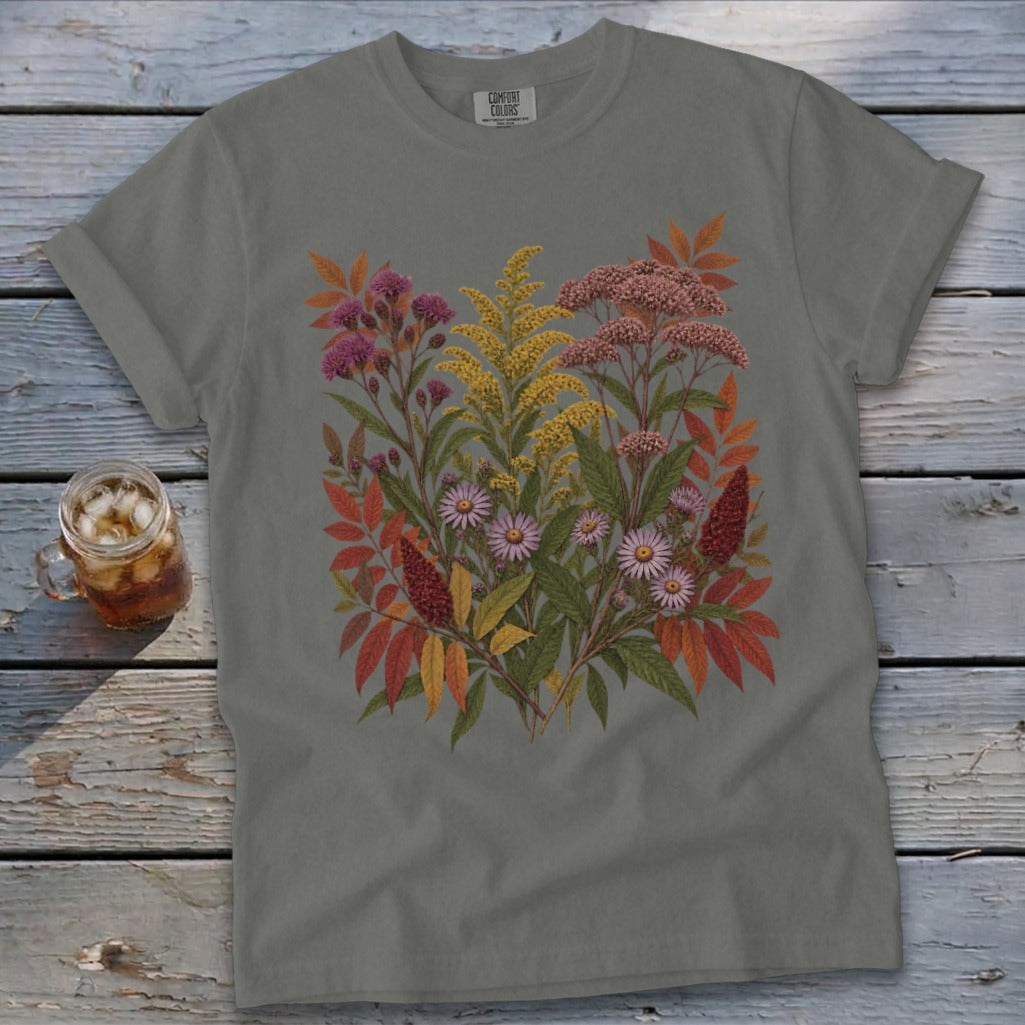 Gray t-shirt with a botanical illustration of wildflowers and autumn leaves.
