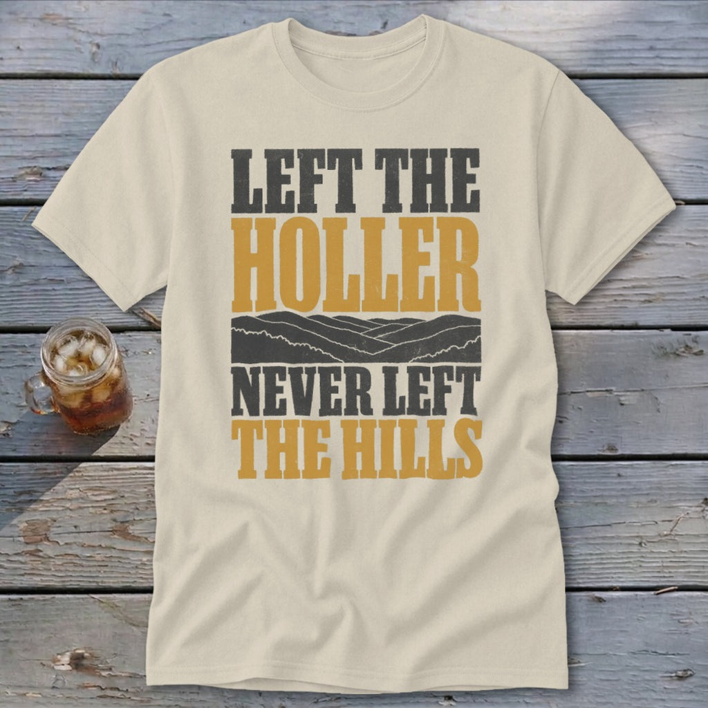 Cream t-shirt with "LEFT THE HOLLER NEVER LEFT THE HILLS" text and mountains.