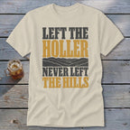 Cream t-shirt with "LEFT THE HOLLER NEVER LEFT THE HILLS" text and mountains.