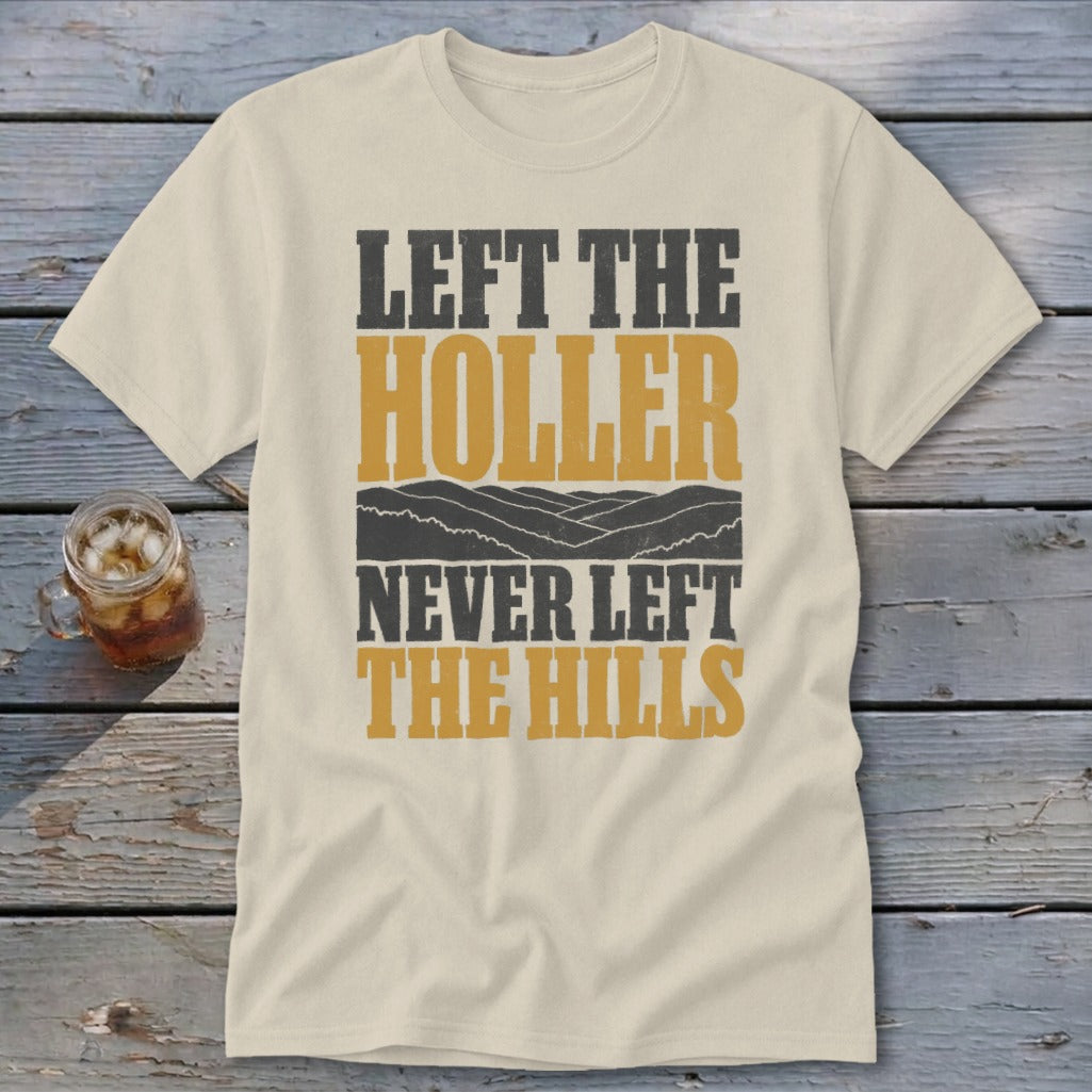 Cream t-shirt with "LEFT THE HOLLER NEVER LEFT THE HILLS" text and mountains.