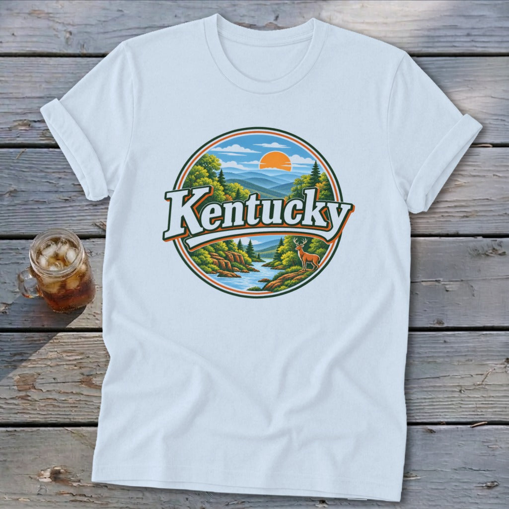 White t-shirt with circular Kentucky landscape graphic featuring deer, river, and mountains.