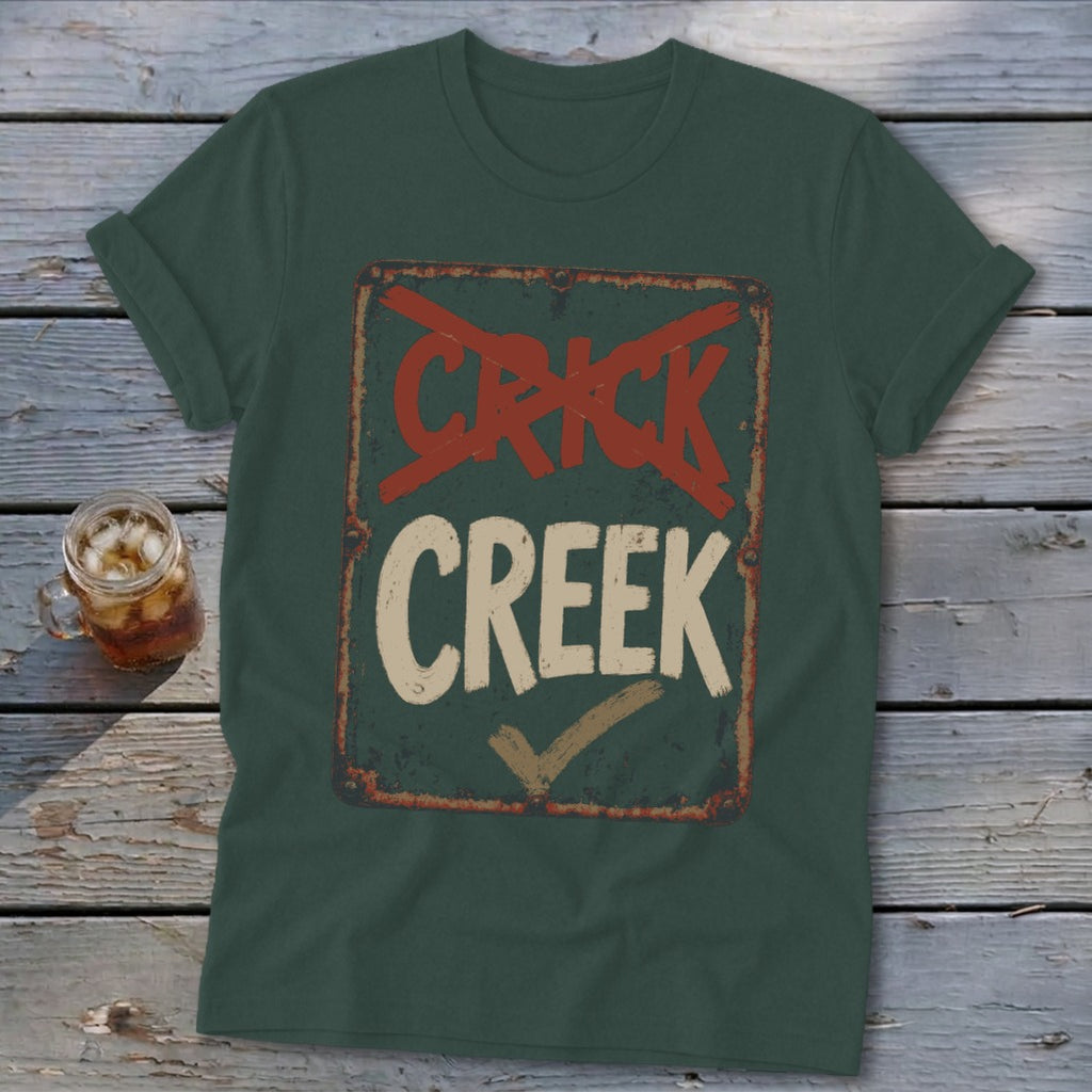 Dark green t-shirt with distressed "CRICK CREEK" sign graphic, "CRICK" crossed out.