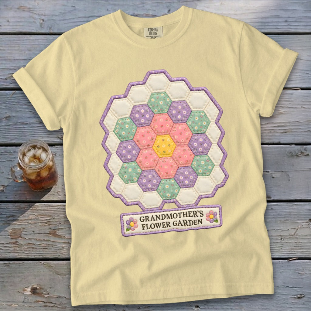 Light yellow t-shirt with a hexagonal quilt design and "GRANDMOTHER'S FLOWER GARDEN" text.