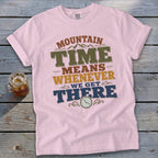 Pink t-shirt with "Mountain Time Means Whenever We Get There" text and clock graphic.