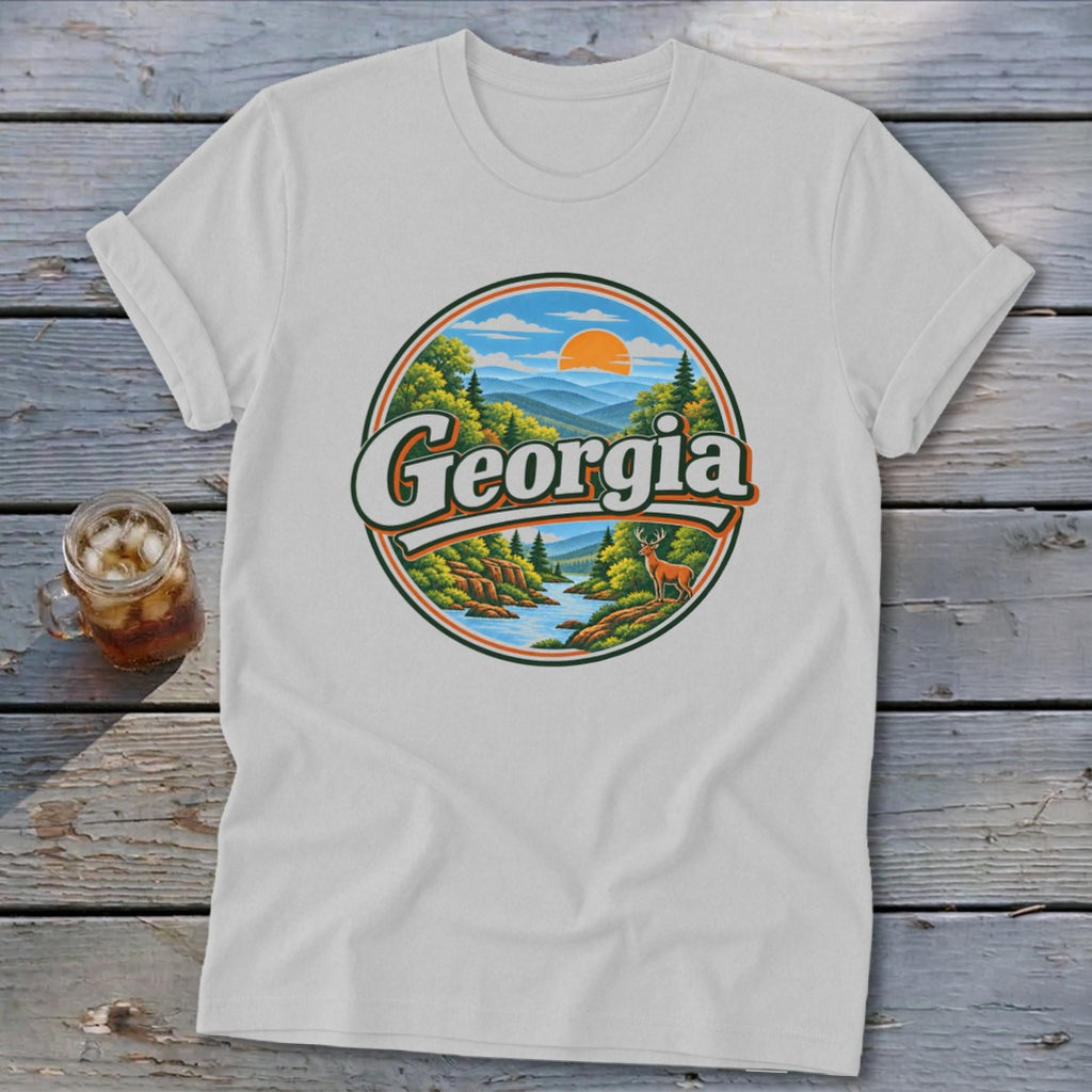 White t-shirt with circular Georgia mountain landscape graphic and deer.