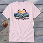 Pink t-shirt with a heart over a mountain landscape and "Appalachia Strong" text.