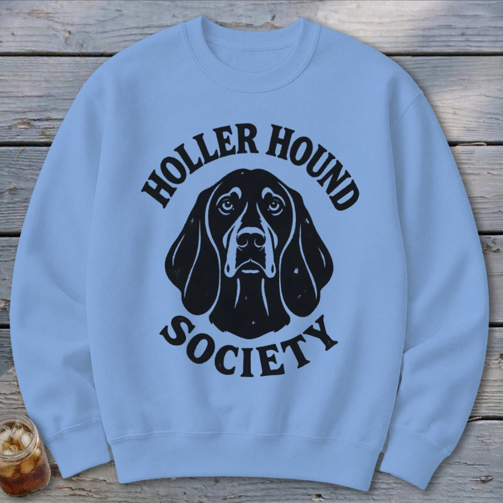 Light blue sweatshirt with black "Holler Hound Society" text and dog head graphic.