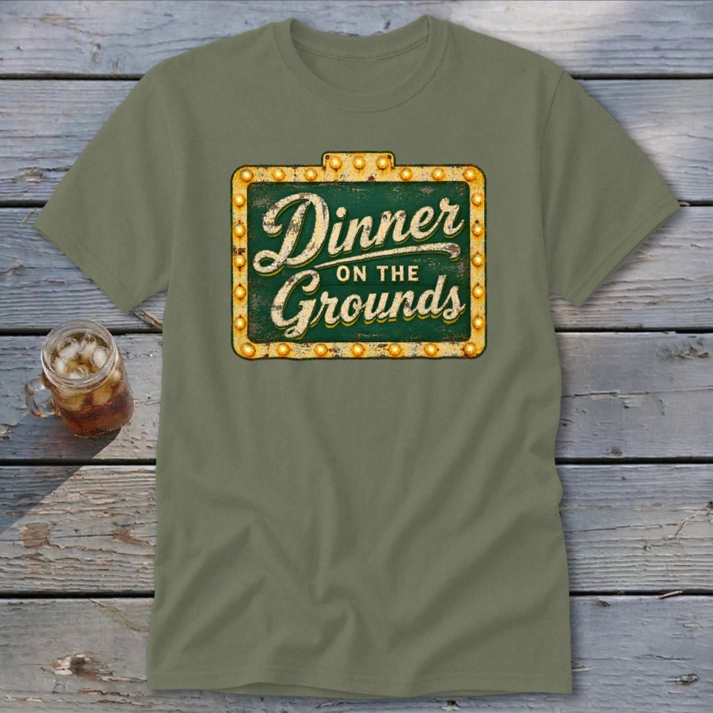 Olive green short-sleeve t-shirt featuring a vintage marquee sign graphic that reads Dinner on the Grounds.