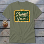 Olive green short-sleeve t-shirt featuring a vintage marquee sign graphic that reads Dinner on the Grounds.