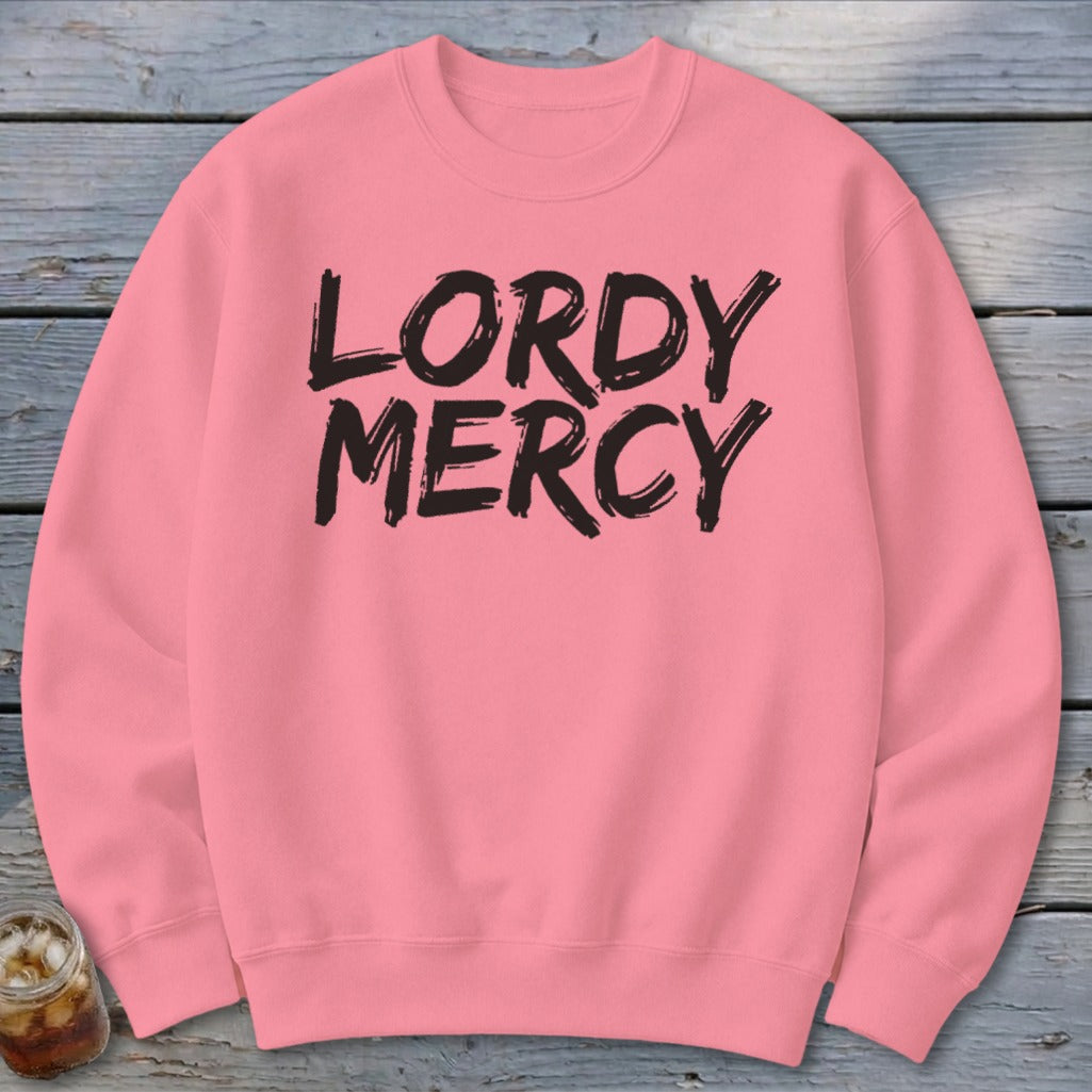 Pink crewneck sweatshirt with black "LORDY MERCY" text.