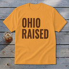 Orange t-shirt with "Ohio Raised" in dark brown text.