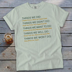 Light green t-shirt with green and orange text listing things done, not done, want to do, will do, won't do.