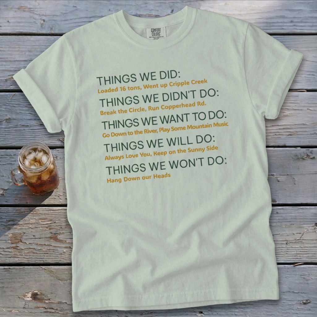 Light green t-shirt with green and orange text listing things done, not done, want to do, will do, won't do.