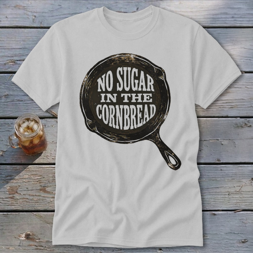 White t-shirt with graphic of a cast iron skillet saying "No Sugar In The Cornbread".
