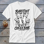 White t-shirt with "BAREFOOT ON THE CREEK BANK" text and drawing of bare feet.