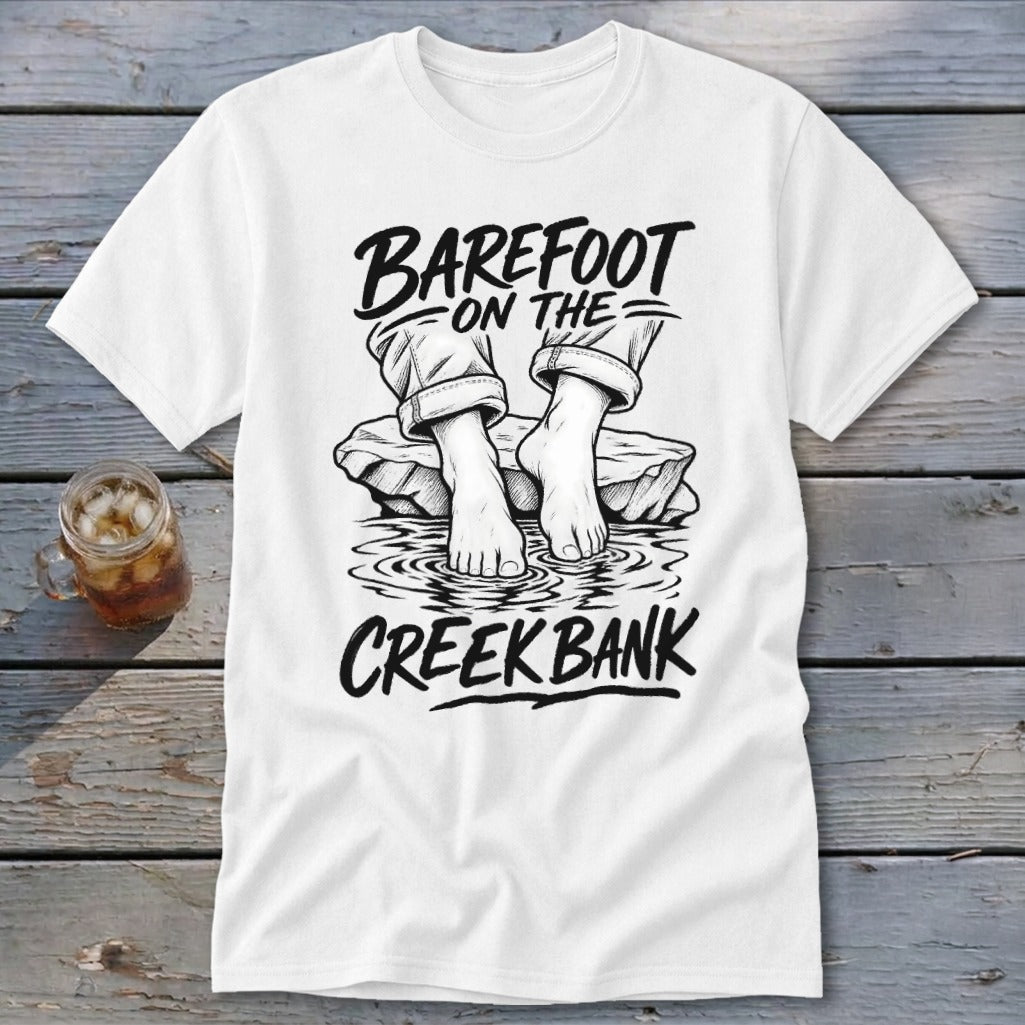 White t-shirt with "BAREFOOT ON THE CREEK BANK" text and drawing of bare feet.