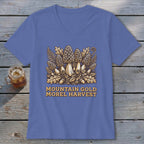 T-shirt with illustration of morel mushrooms, ferns, leaves, and acorns; text reads "MOUNTAIN GOLD MOREL HARVEST".