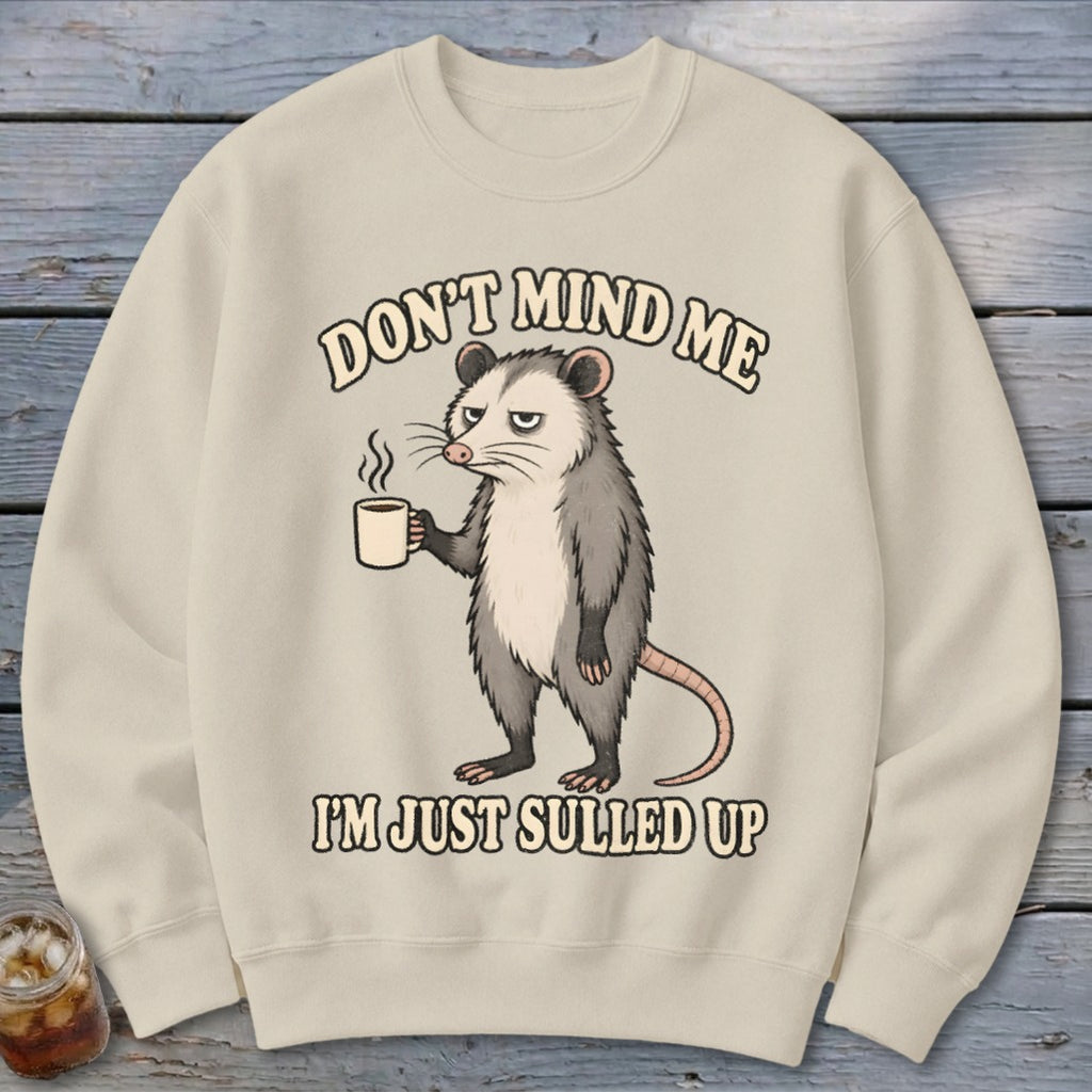 Crewneck sweatshirt with a possum holding coffee and text "Don't mind me I'm just sulled up".