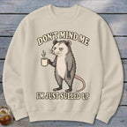 Crewneck sweatshirt with a possum holding coffee and text "Don't mind me I'm just sulled up".