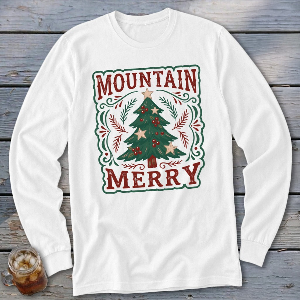 White long-sleeve t-shirt featuring a Christmas design with a decorated tree and the text Mountain Merry.