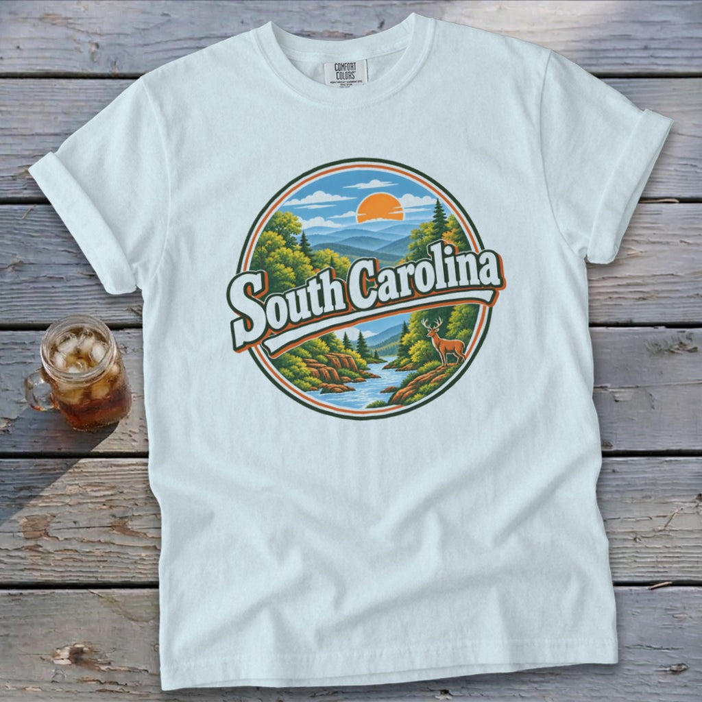 White t-shirt with circular graphic of South Carolina landscape with deer.
