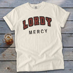 Cream t-shirt with "LORDY MERCY" text in distressed maroon and black lettering.
